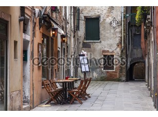Фотообои «VENICE, ITALY on MAY 3, 2015. Typical city street. Old houses and small outside cafe, look in the cloudy spring morning» - фото (1)